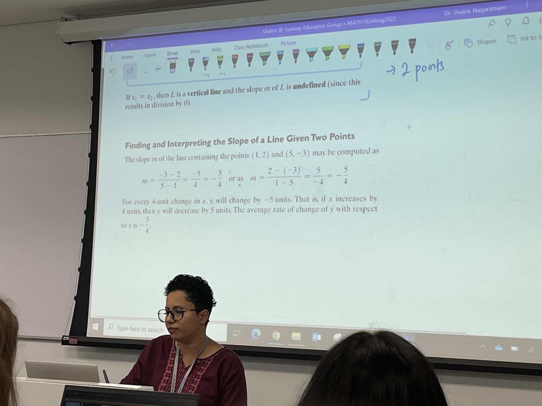 Excellence Academy maths lesson with projected notes