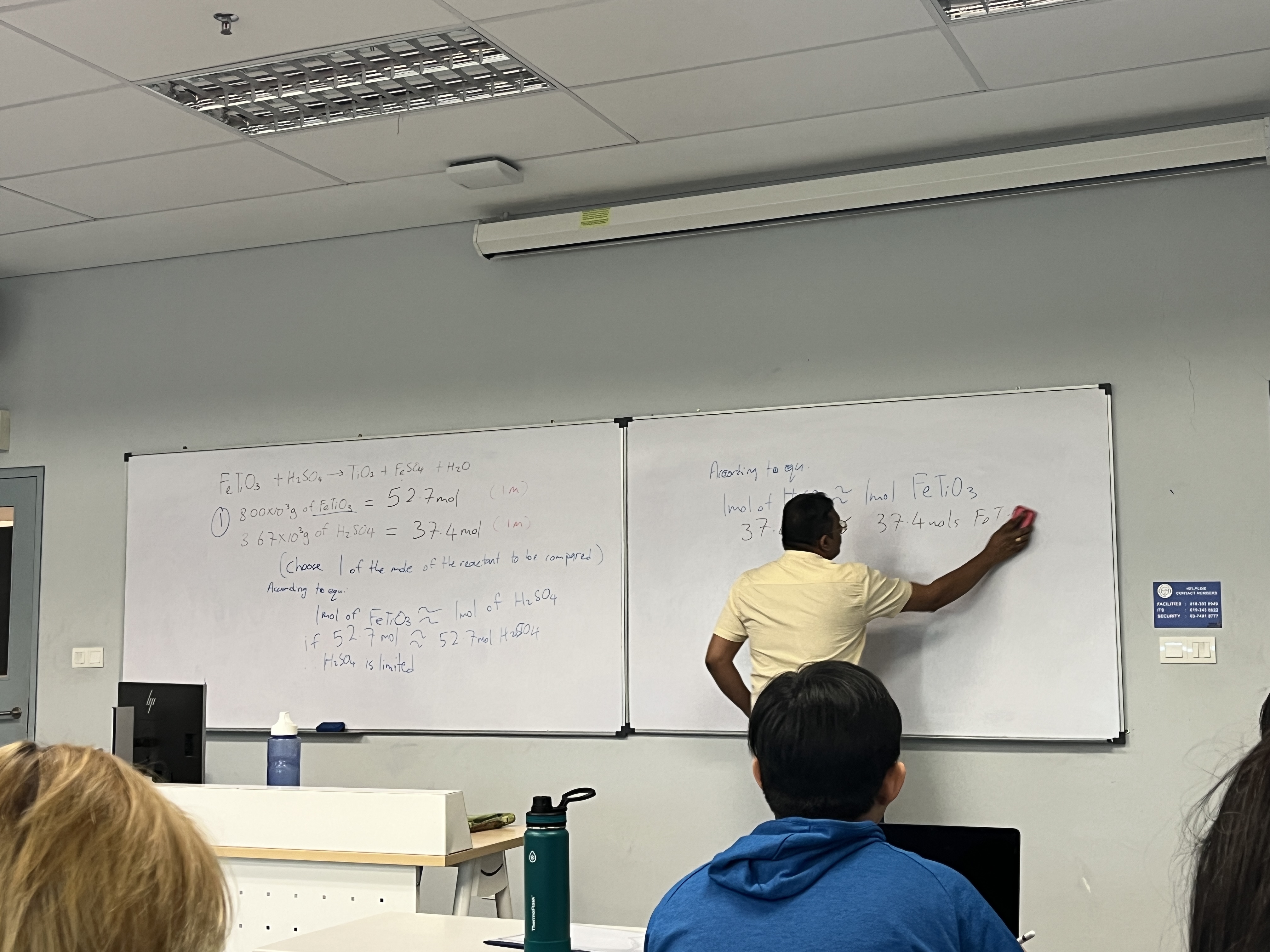 Excellence Academy chemistry lecturer explaining concepts