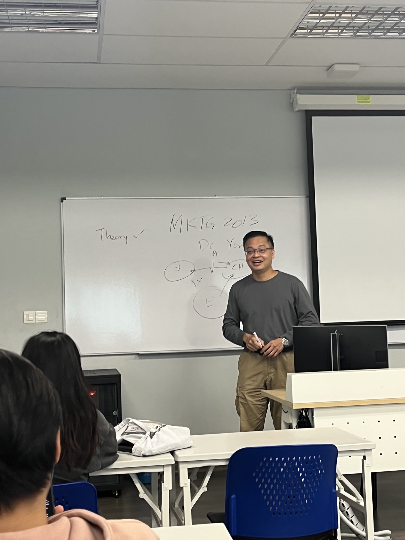 Excellence Academy lecturer teaching an IGCSE theory class