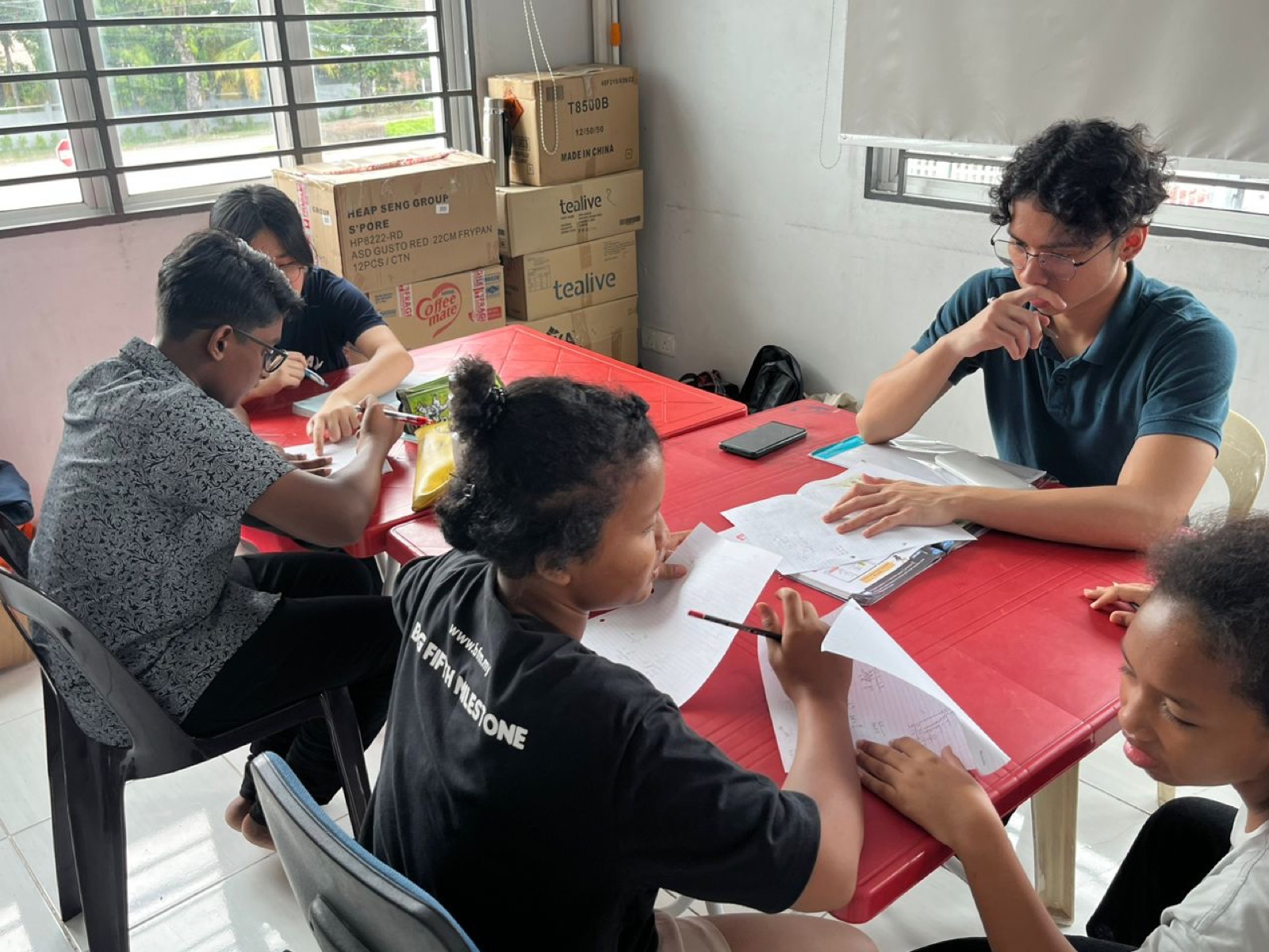 Excellence Academy students working in a small group tuition session