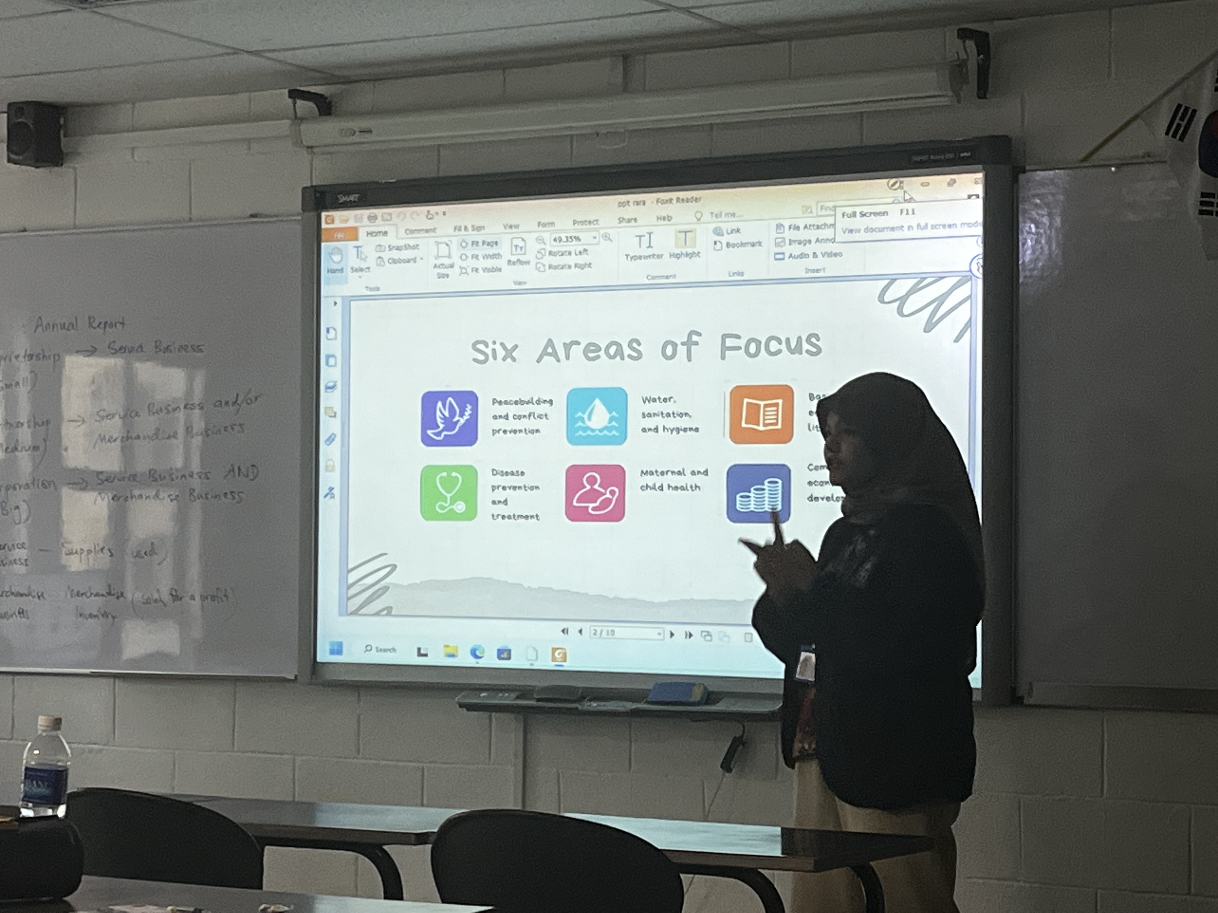 Excellence Academy lecturer presenting to a class