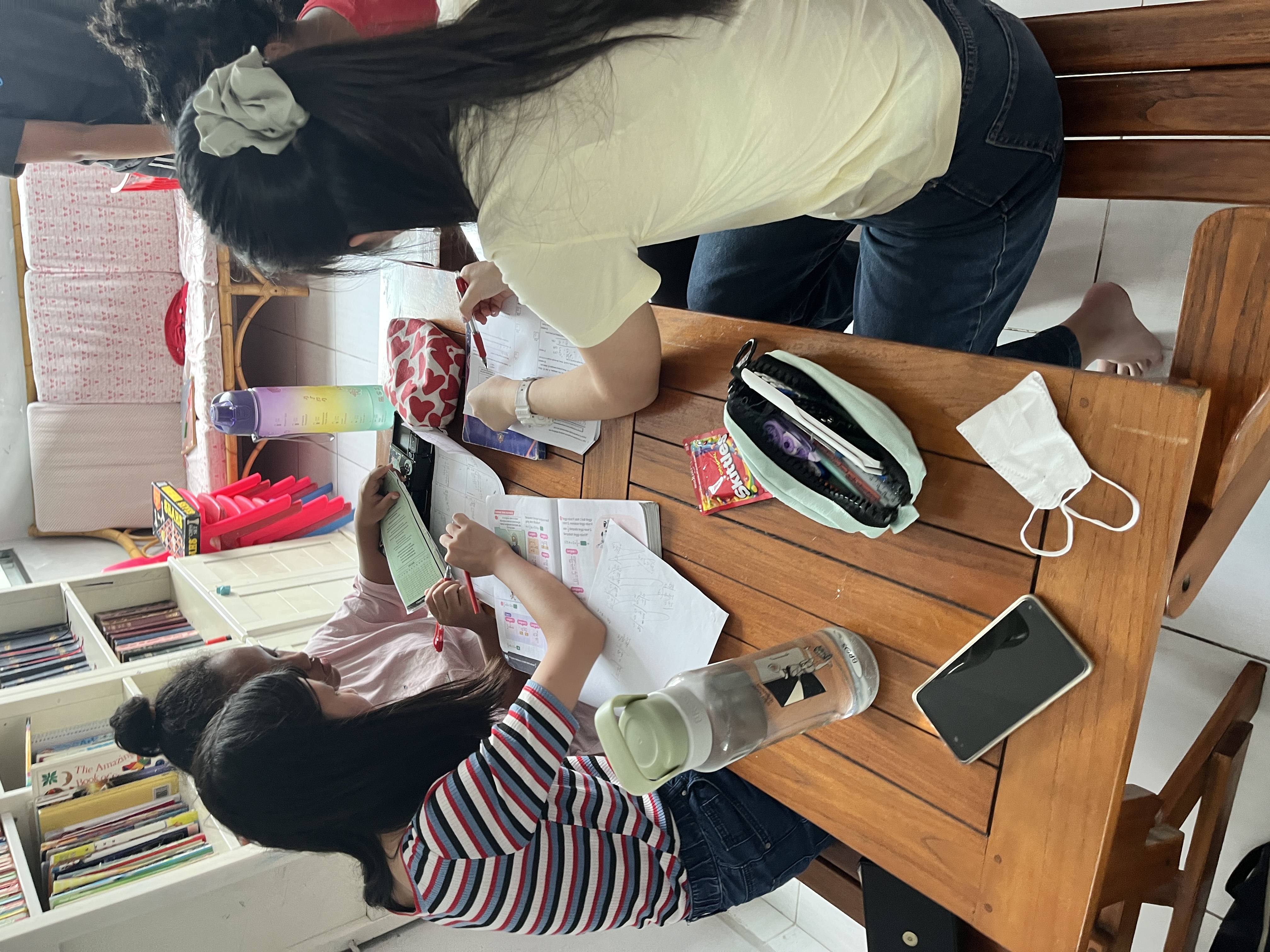 Excellence Academy students studying together at a table